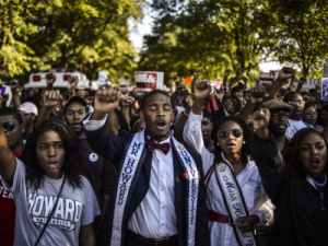 Students of Howard University march from campus to the Lincoln Memorial to participate in the Realize the Dream Rally for the 50th anniversary of the March on Washington