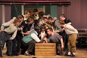 The men of Carousel singing "Blow High, Blow Low" in this yaers musical "Carousel"