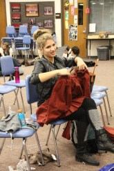 Emily fixing a costume she made for "Around the World in 80 Days"