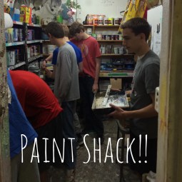 The men in the Paint Shack mixing paints and cleaning