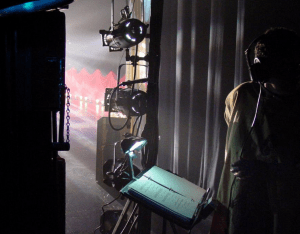 A stage manager is responsible for supervising the backstage crew of a theater or television production.